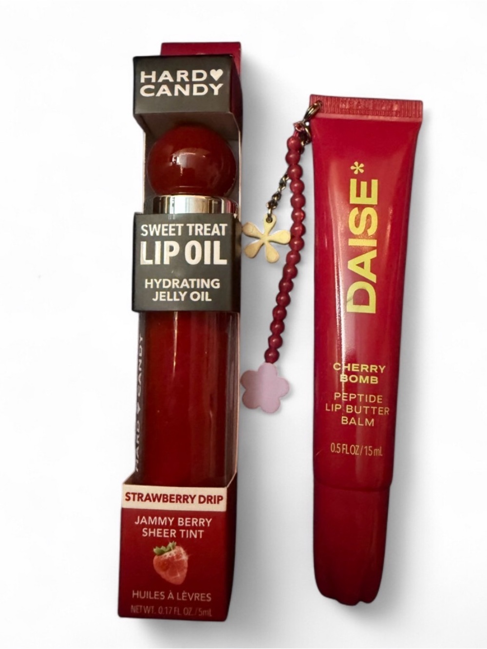DAISE cherry bomb lip balm and Hard Candy strawberry lip oil